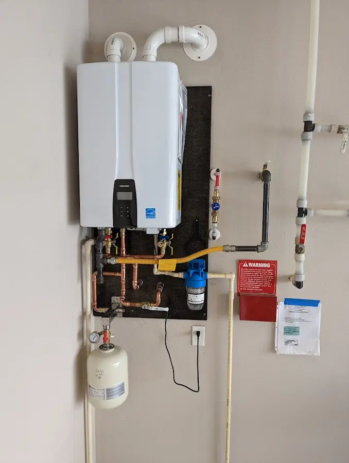 Professional plumber installing copper piping in a Armona home